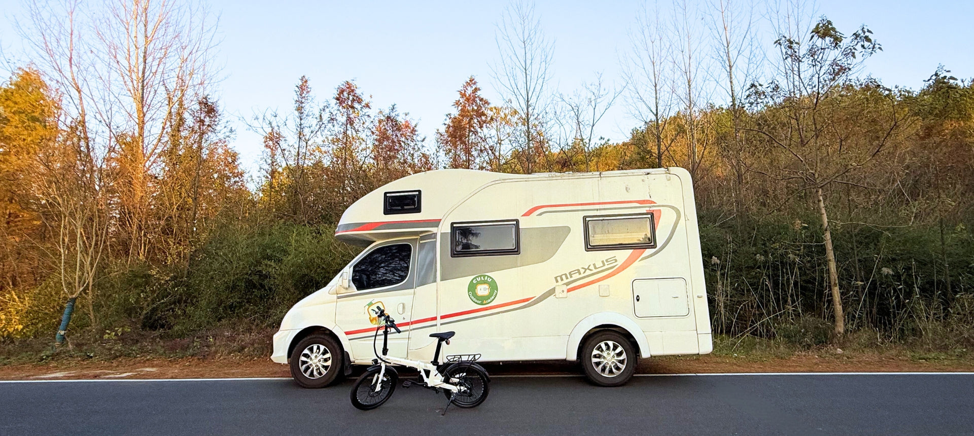 qualisports volador folding ebike in front of a rv