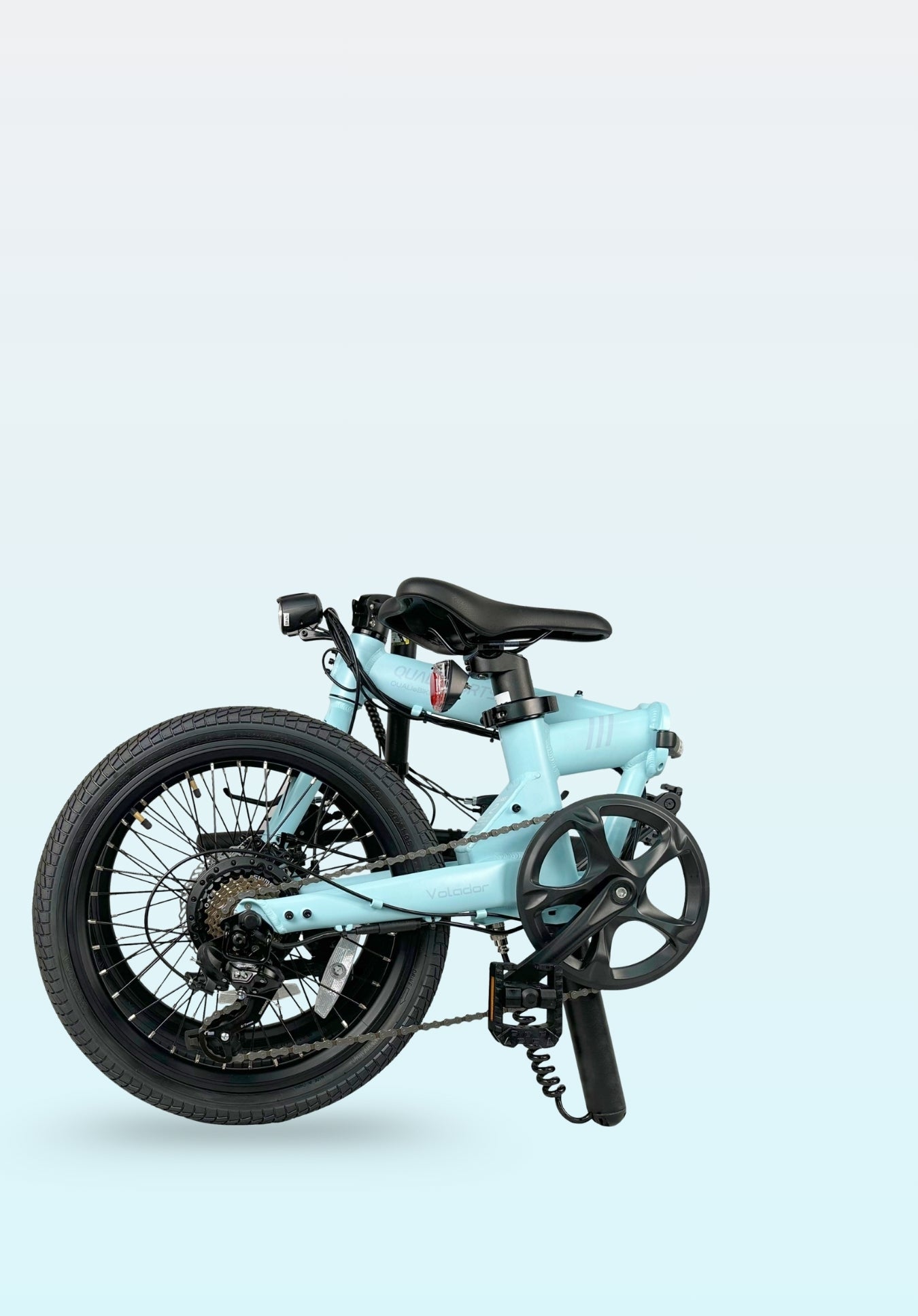 qualisports volador Light blue folding electric bicycle on a light blue background
