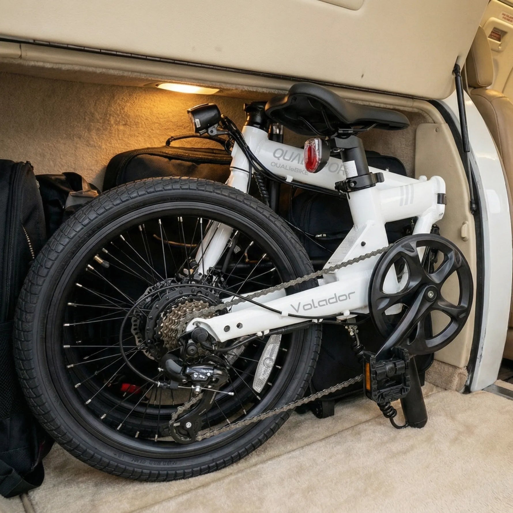 White volador electric bike inside a vehicle with 'Valdor' branding.